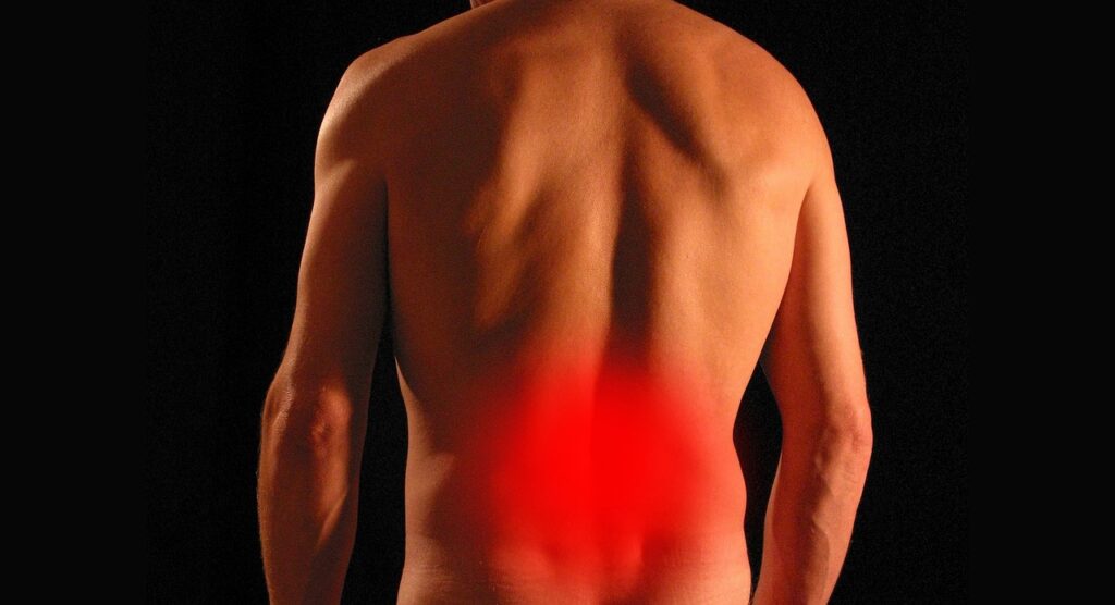 An image of a man with a red back, indicating chronic pain and discomfort.